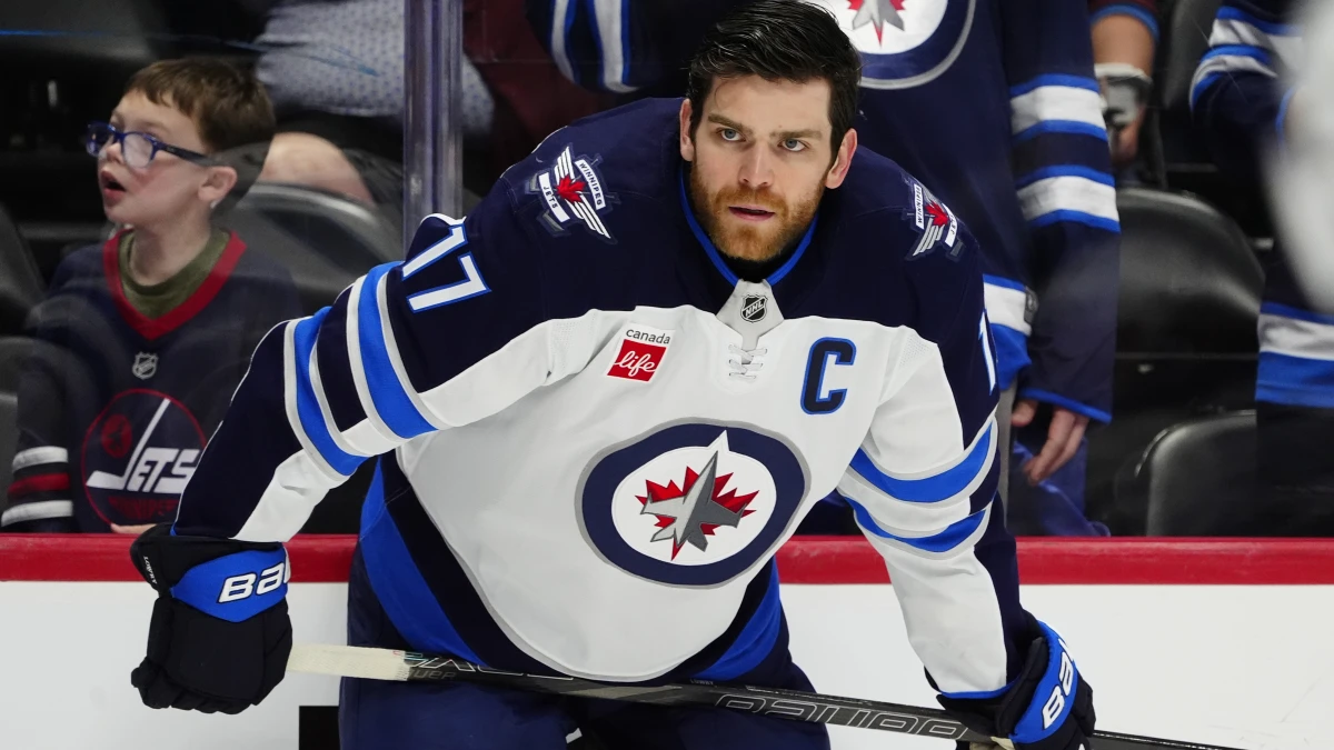 Winnipeg Jets center Adam Lowry (17) before the game against the Colorado Avalanche at Ball Arena.