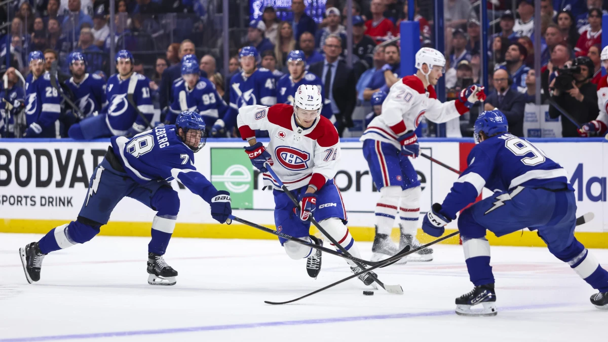 Montreal Canadiens forward Zachary Bolduc (76) skates between Tampa Bay Lightning defenseman Emil Lilleberg (78) and forward Joe Veleno (90) during the second period in game one of the first round of the 2026 Stanley Cup Playoffs at Benchmark International Arena.