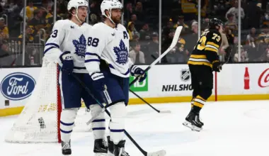 As Boston Bruins defenseman Charlie McAvoy (73) skates away, Toronto Maple Leafs right wing William Nylander (88) smiles with left wing Matthew Knies (23) after Knies scored during the third period at TD Garden.