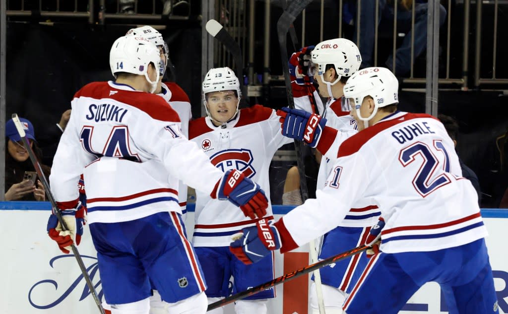 Cole Caufield (center) celebrates with teammates after a second period goal, the first of his two scores, in the Rangers’ loss to the Canadiens at the Garden. Jason Szenes for New York Post