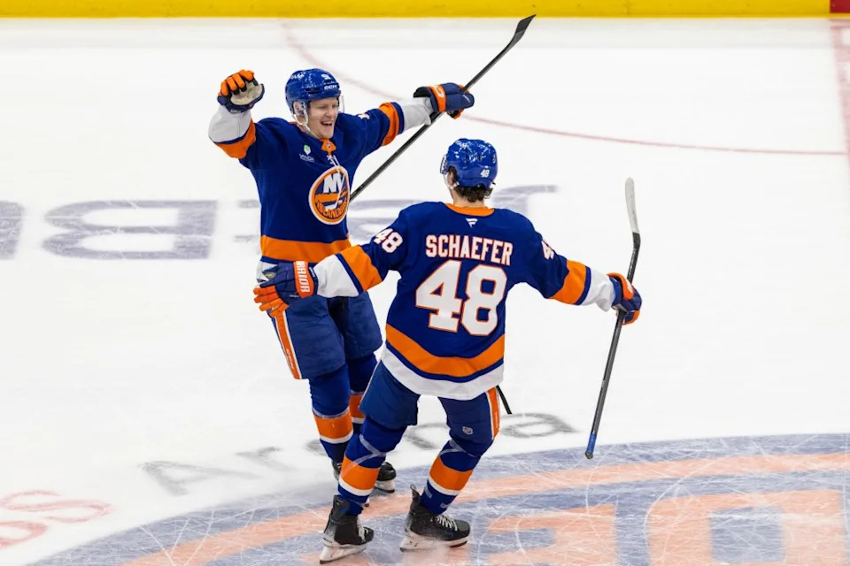 New York Islanders left wing <a class="link " href="https://sports.yahoo.com/nhl/players/8683/" data-i13n="sec:content-canvas;subsec:anchor_text;elm:context_link" data-ylk="slk:Emil Heineman;sec:content-canvas;subsec:anchor_text;elm:context_link;itc:0" data-yga="{"yLinkElement":"context_link","yModuleName":"content-canvas","yLinkText":"Emil Heineman","ySubModuleName":"anchor_text","yHasCommerce":false}">Emil Heineman</a> (51) celebrates with New York Islanders defenseman Matthew Schaefer (48) after he scores the game winning goal during shoot out at UBS Arena, Saturday, Dec. 13, 2025, in Elmont, NY. Corey Sipkin for the NY POST