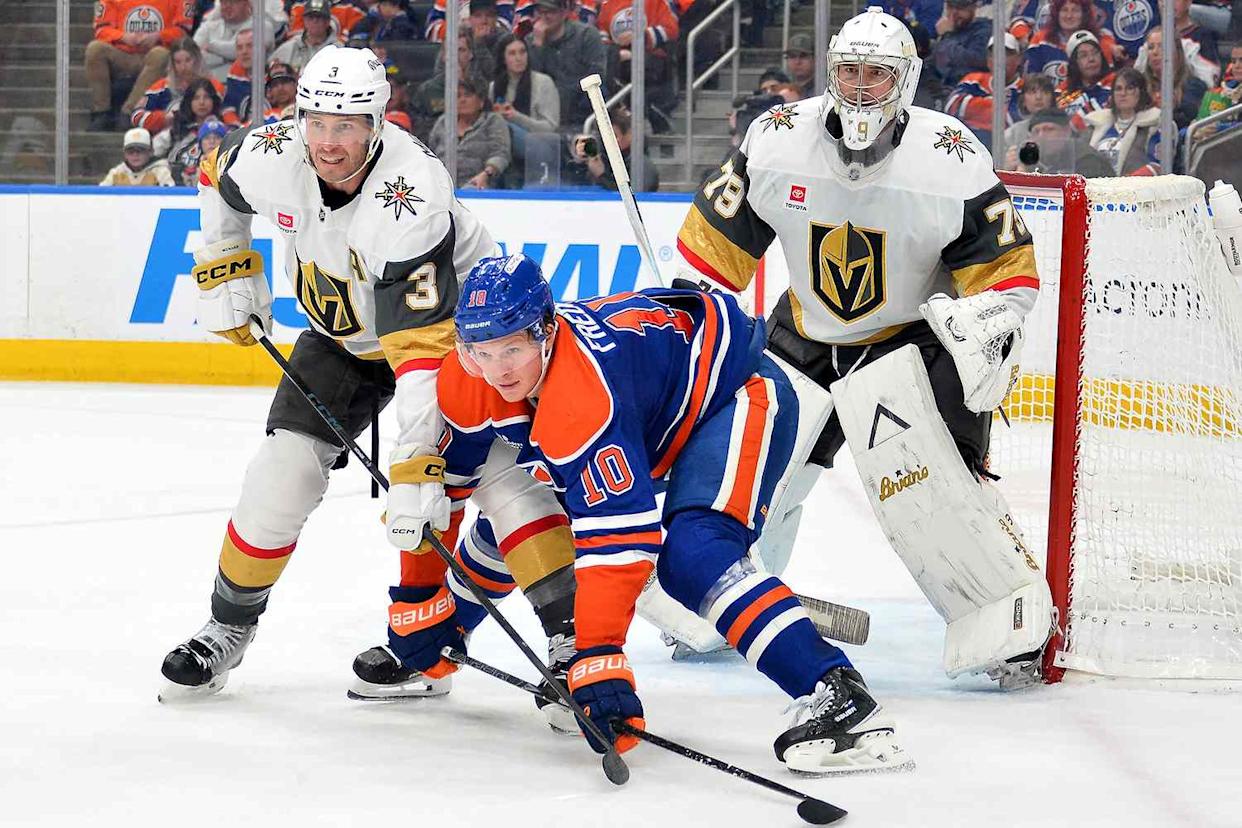 Vegas Golden Knights players Brayden McNabb (left) and Carter Hart (right), and Edmonton Oilers player Trent Frederic (center) on April 4Credit: Leila Devlin/Getty