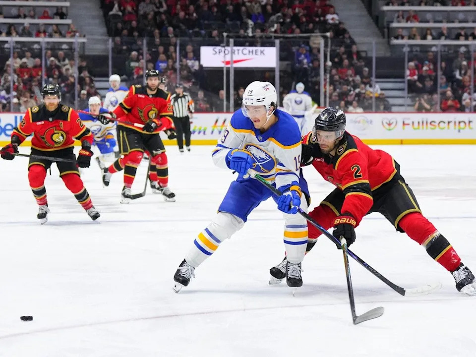 Artem Zub, right, of the Senators checks Peyton Krebs of the Sabres in the first period of Thursday’s game at the Canadian Tire Centre.