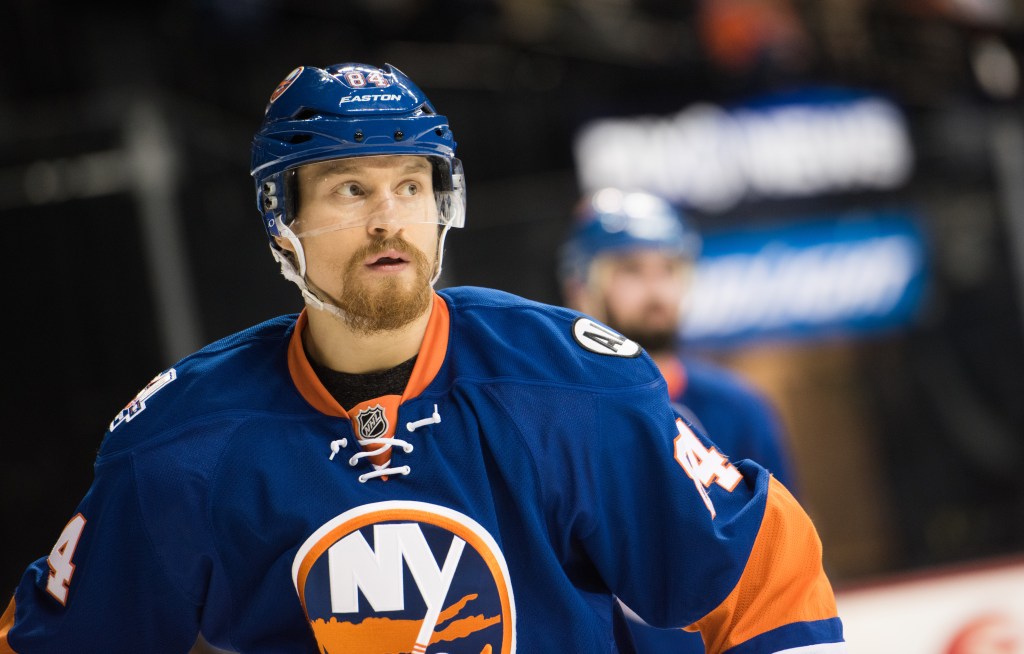 New York Islanders center Mikhail Grabovski (84) in a blue and orange uniform.