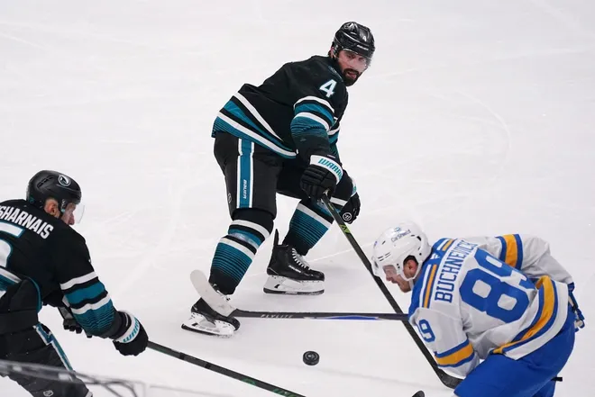 Mar 30, 2026; San Jose, California, USA; San Jose Sharks defenseman Vincent Desharnais (5) and defenseman Nick Leddy (4) attempt to control the puck along with St. Louis Blues left winger Pavel Buchnevich (89) in the third period at SAP Center at San Jose.