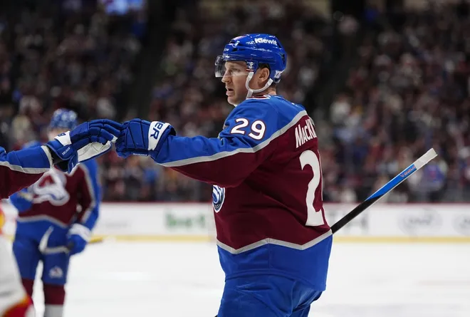 Mar 30, 2026; Denver, Colorado, USA; Colorado Avalanche center Nathan MacKinnon (29) celebrates his in the second period goal against the Calgary Flames] at Ball Arena.