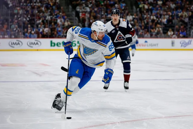 Apr 5, 2026; Denver, Colorado, USA; St. Louis Blues left wing Pavel Buchnevich (89) controls the puck in the third period against the Colorado Avalanche at Ball Arena.