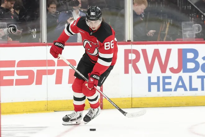 Apr 7, 2026; Newark, New Jersey, USA; New Jersey Devils center Jack Hughes (86) skates with the puck against the Philadelphia Flyers during the third period at Prudential Center.