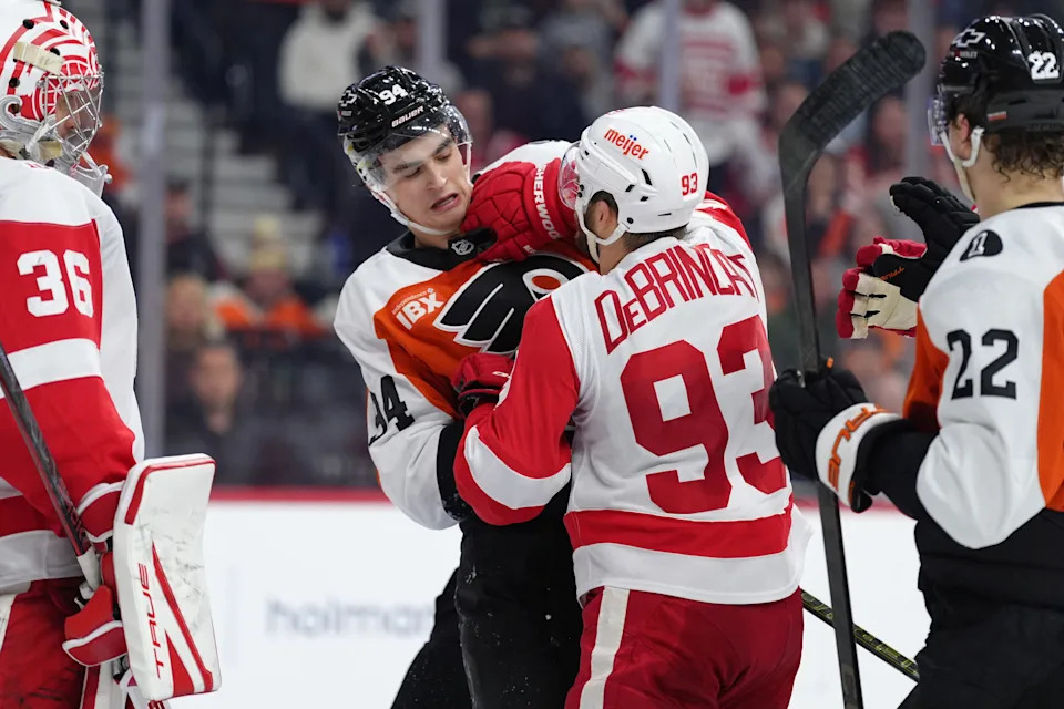 Apr 2, 2026; Philadelphia, Pennsylvania, USA; Philadelphia Flyers right wing Porter Martone (94) scuffles with Detroit Red Wings right wing Alex Debrincat (93) in the second period at Xfinity Mobile Arena. Mandatory Credit: Kyle Ross-Imagn Images
