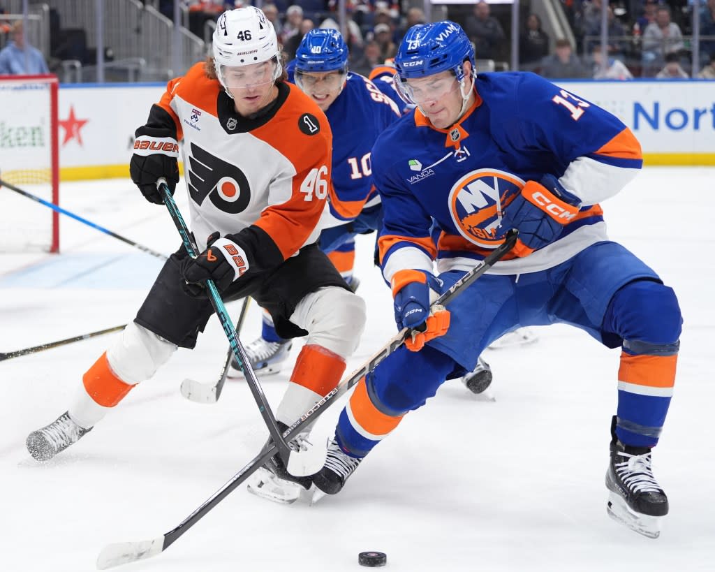 Mathew Barzal battles for Trevor Zegras for the puck during the Islanders’ loss to the Flyers on April 3, 2026 at UBS Arena. Alexander Wohl-Imagn Images
