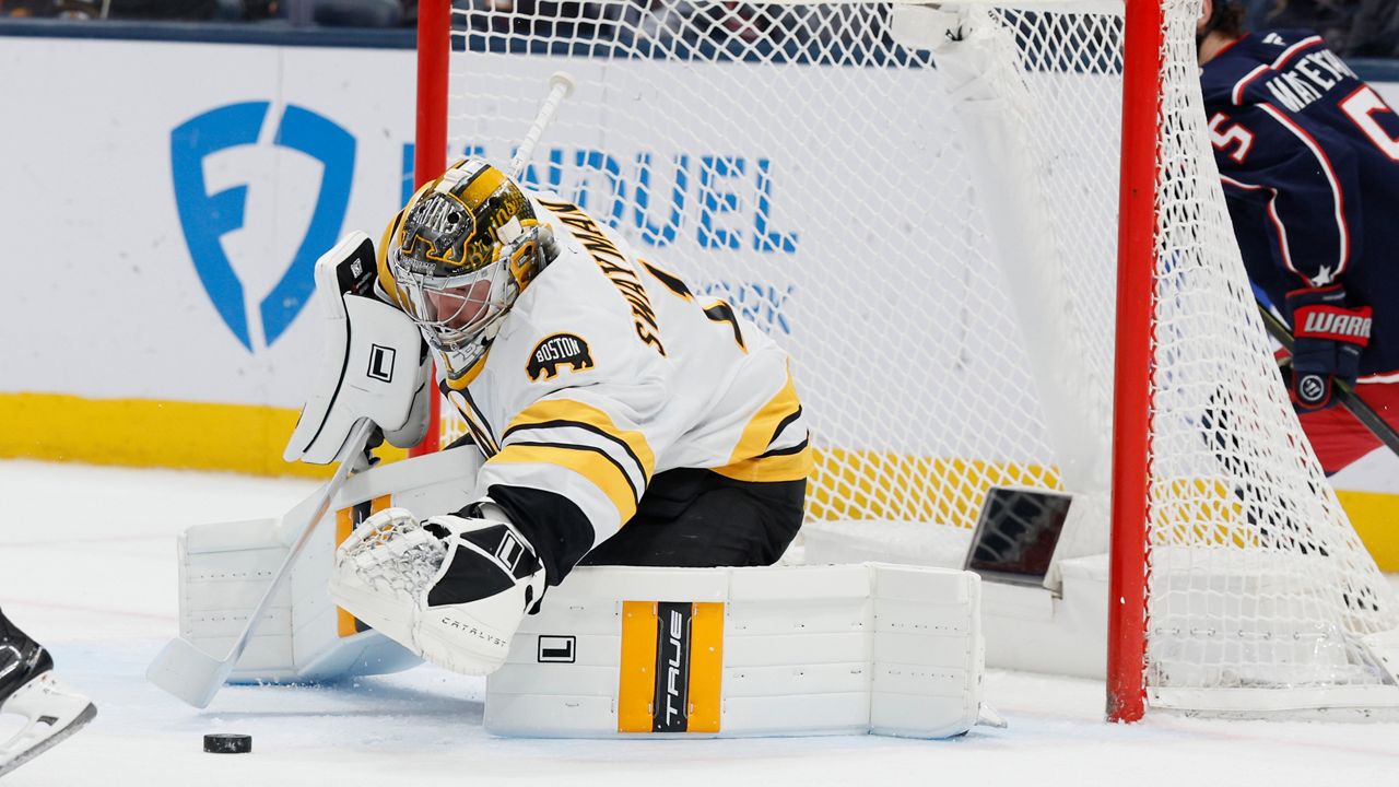 Boston Bruins' Jeremy Swayman makes a save against the Columbus Blue Jackets during the first period of an NHL hockey game, Sunday, March 29, 2026, in Columbus, Ohio. (AP Photo/Jay LaPrete)