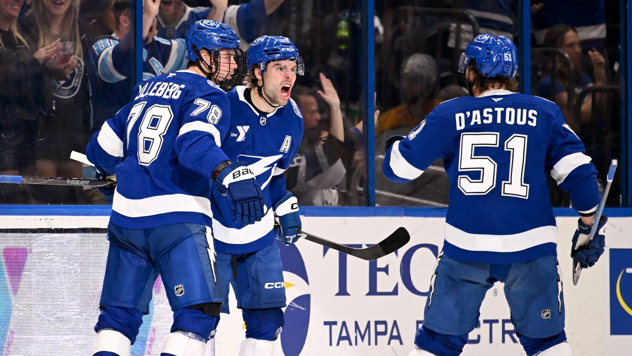 Tampa Bay Lightning defenseman Emil Lilleberg (78), left wing Brandon Hagel (38) and defenseman Charle-Edouard D'Astous (51) celebrate Hagel's goal during the third period of an NHL hockey game against the Nashville Predators, Sunday, March 29, 2026, in Tampa, Fla. (AP Photo/Jason Behnken)