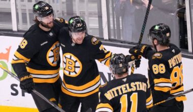 Boston Bruins left wing Viktor Arvidsson, center, is congratulated after his goal against Dallas Stars goaltender Jake Oettinger (29) during the first period of an NHL hockey game, Tuesday, March 31, 2026, in Boston.