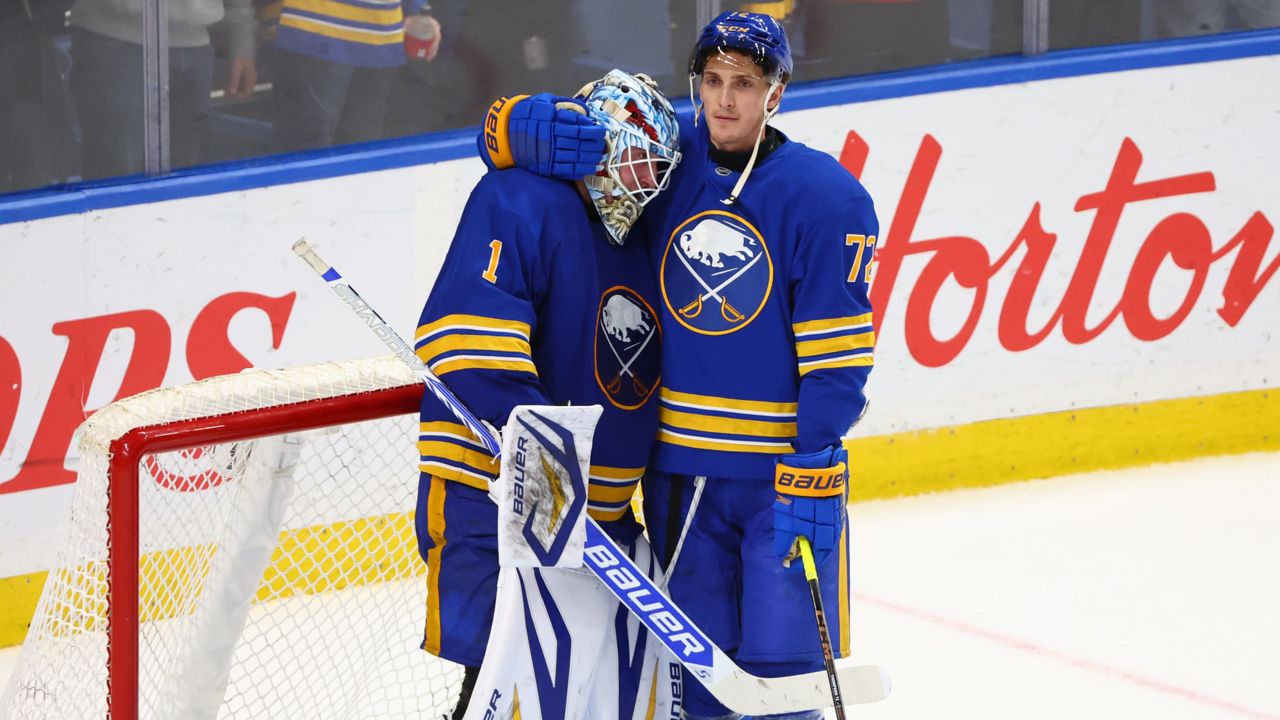 Buffalo Sabres goaltender Ukko-Pekka Luukkonen (1) and center Tage Thompson (72) celebrate victory