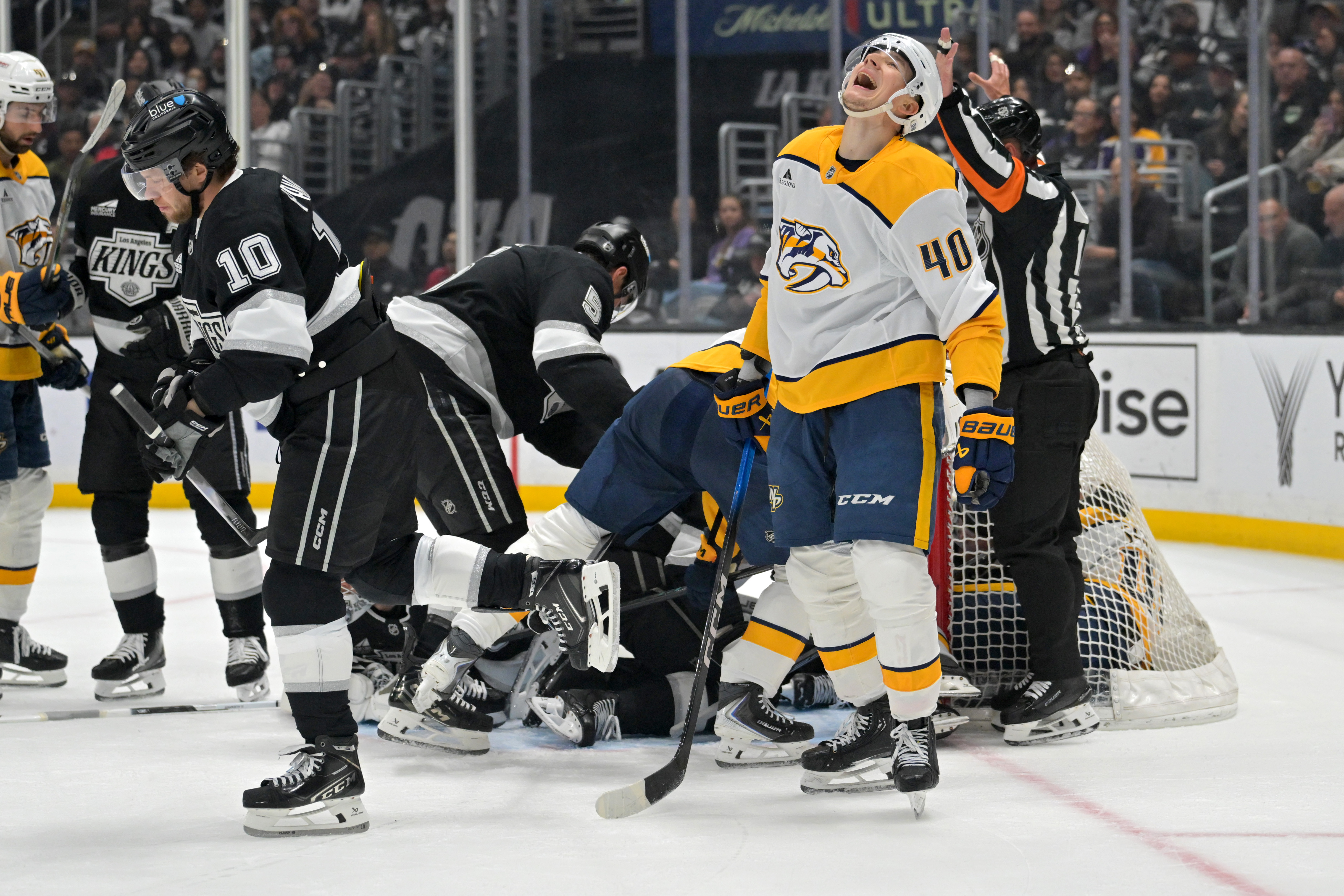 Nashville Predators center Fedor Svechkov, right, reacts after not scoring...