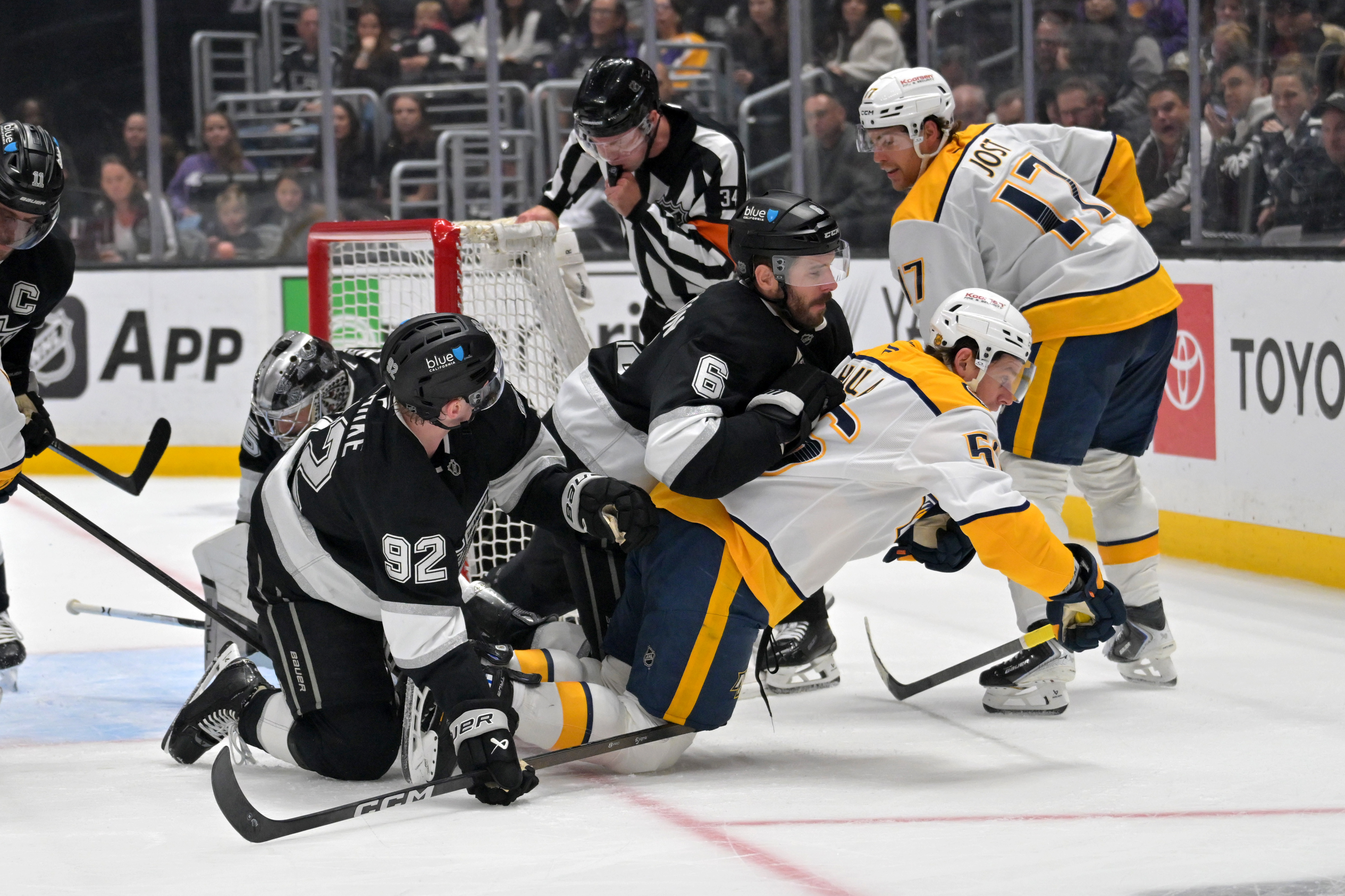 Kings defenseman Brandt Clarke (92), Kings defenseman Joel Edmundson (6),...