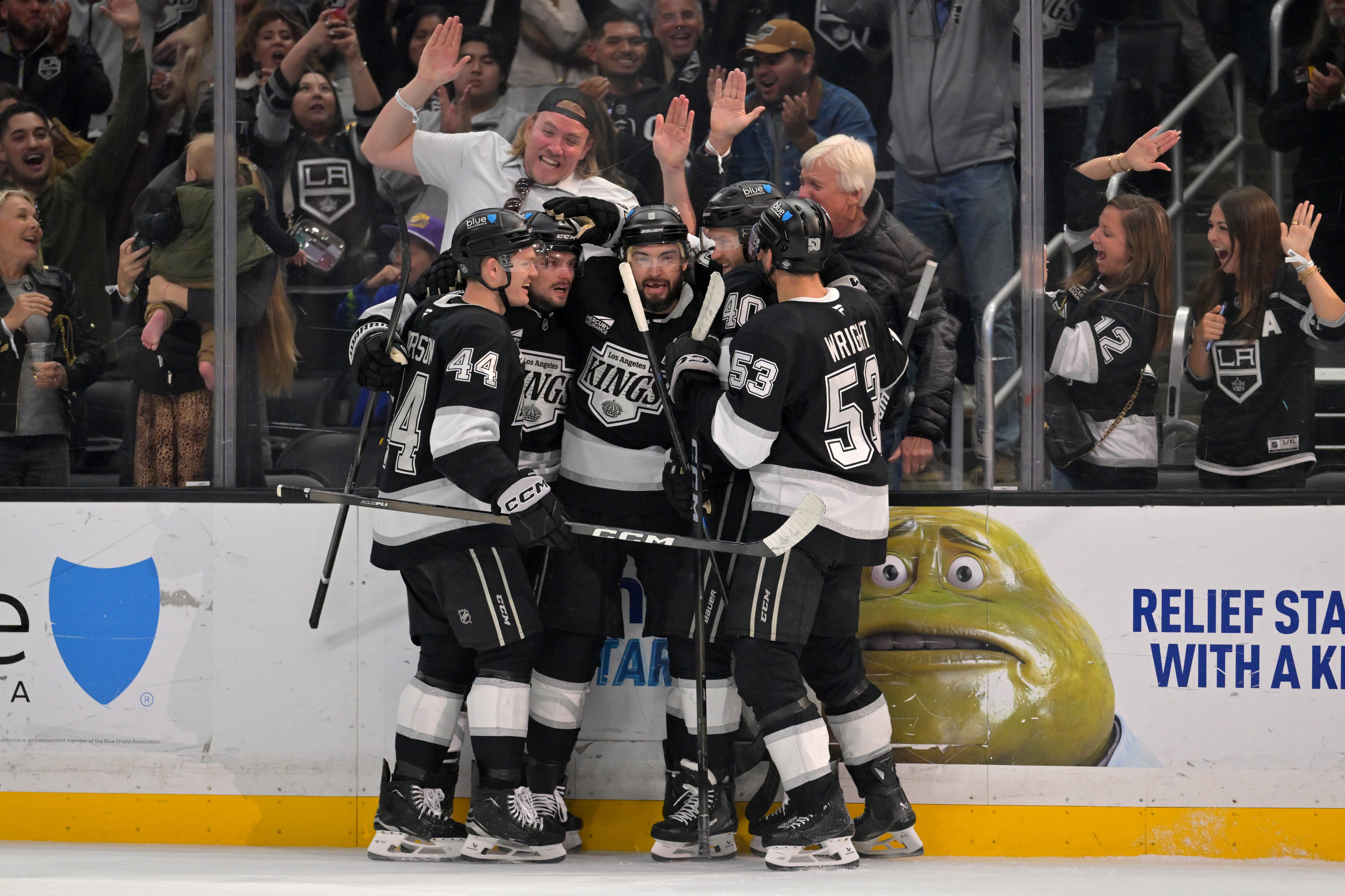 Kings players celebrate after a goal during the second period...