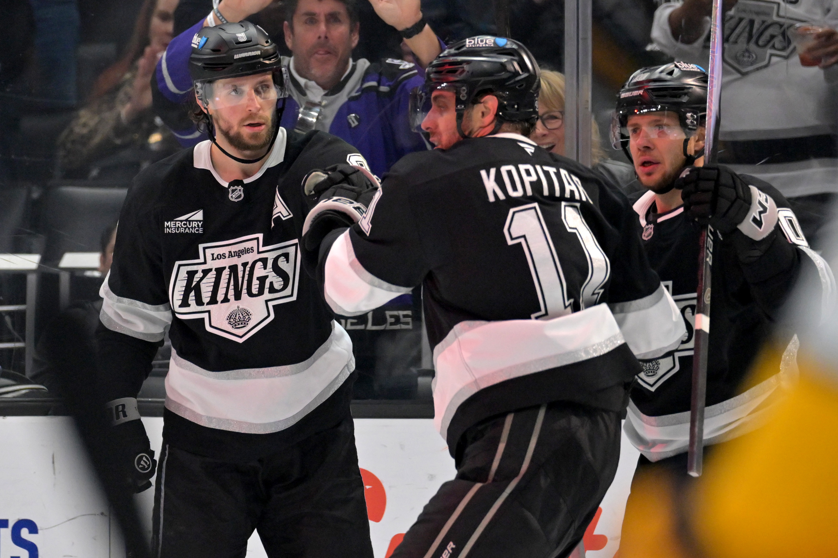 Kings right wing Adrian Kempe (9) is congratulated by center...
