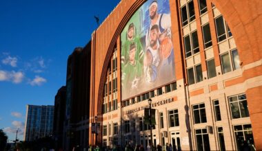 Fans line up outside the doors of American Airlines Center before the start of an NHL hockey game in Dallas, on Tuesday, Oct. 28, 2025. (AP Photo/Tony Gutierrez)