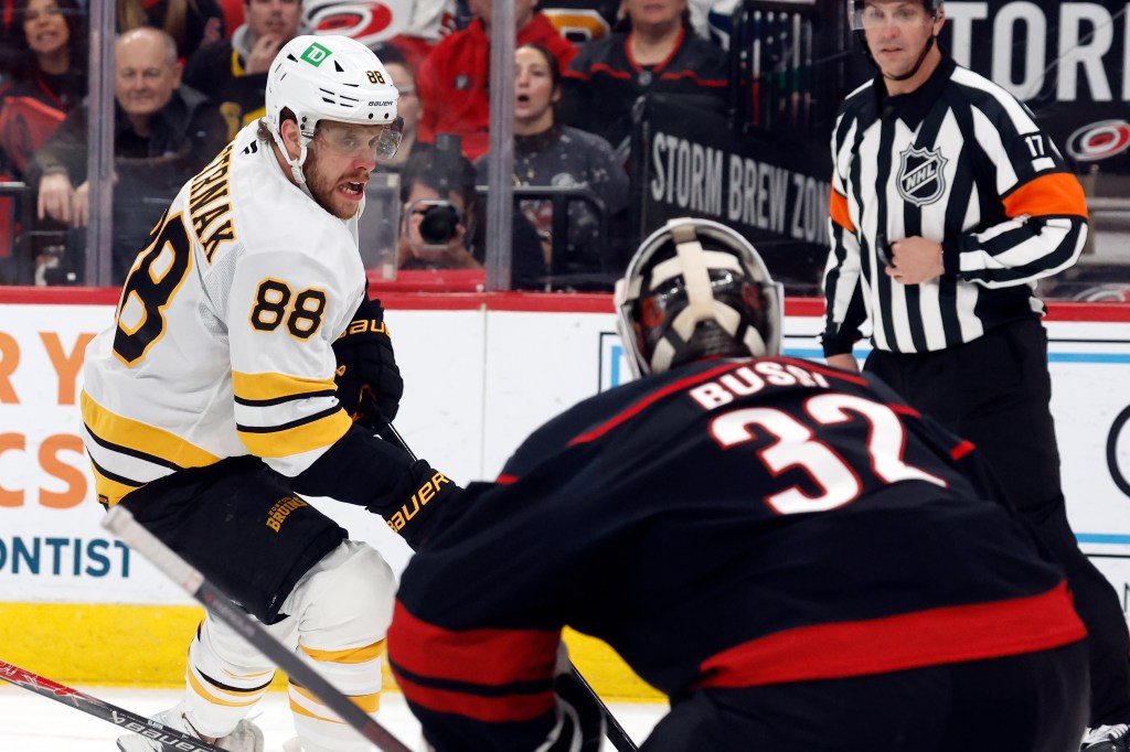 Bruins gain a point, but drop OT decision to Hurricanes, 6-5