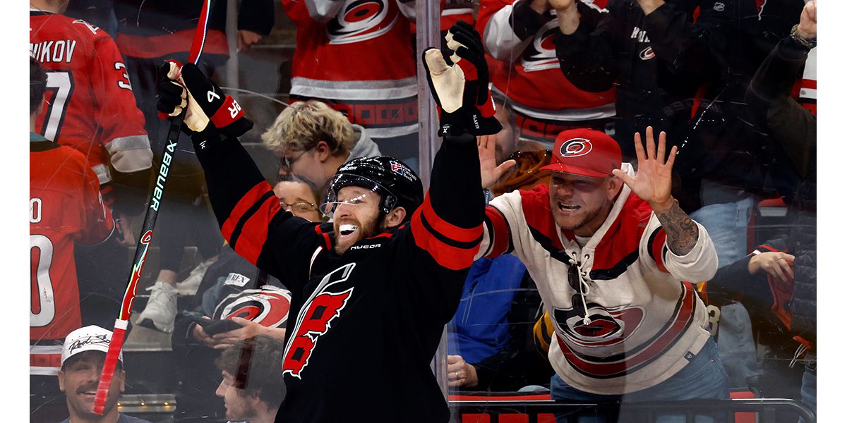 Hurricanes hit milestones, clinch division with OT win over Bruins