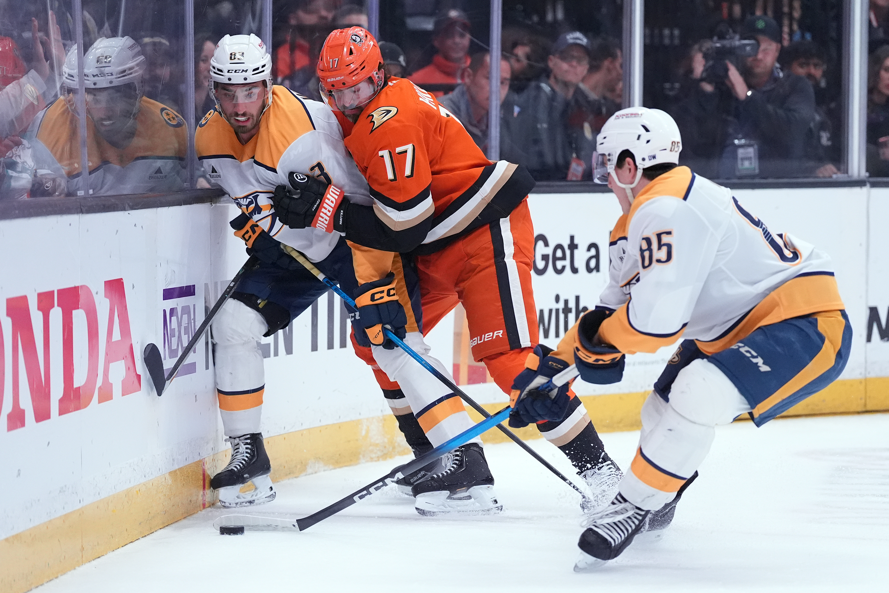 Ducks left wing Alex Killom (17) battles Nashville Predators defenseman...