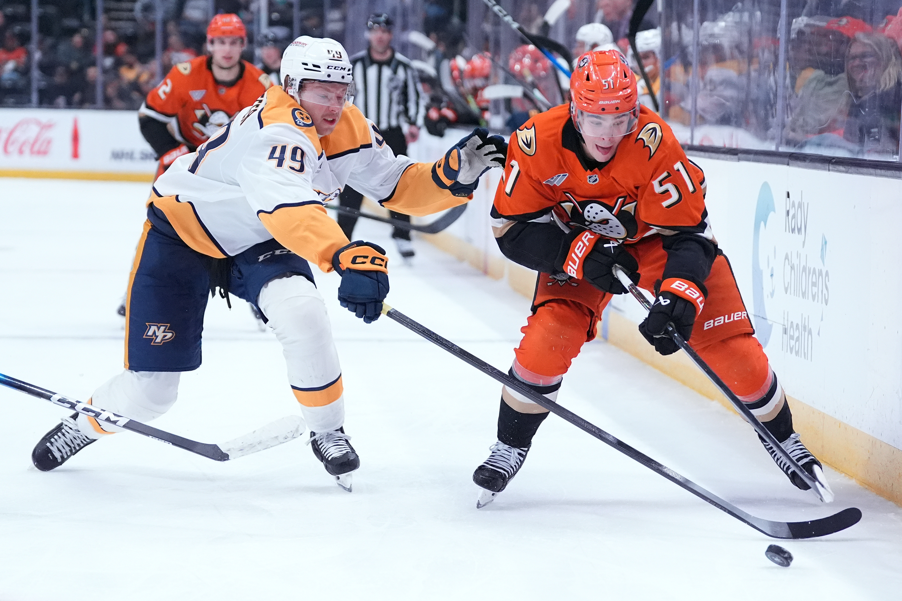 Nashville Predators left wing Reid Schaefer, left, and Ducks defenseman...