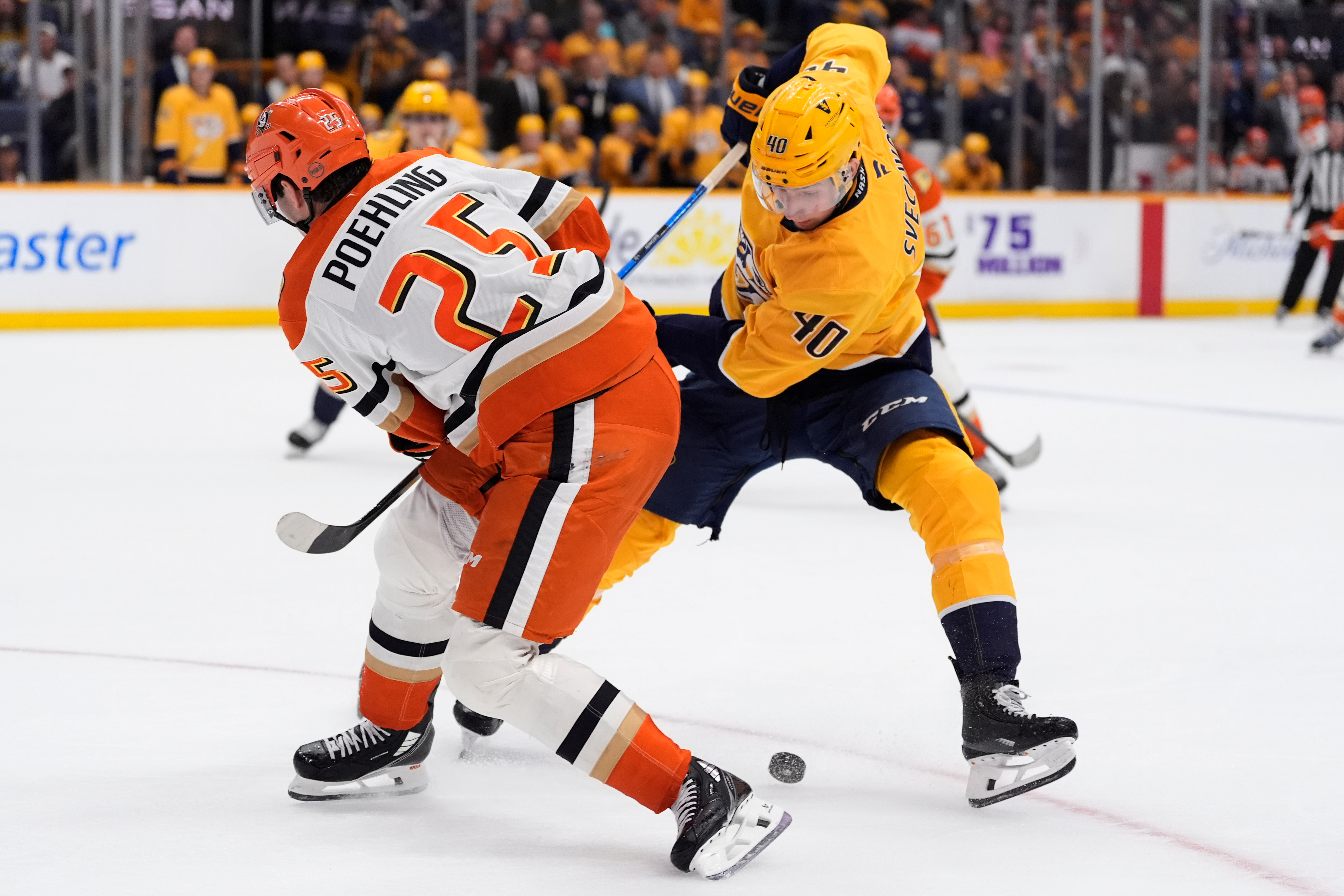 Ducks center Ryan Poehling (25) and Nashville Predators center Fedor...
