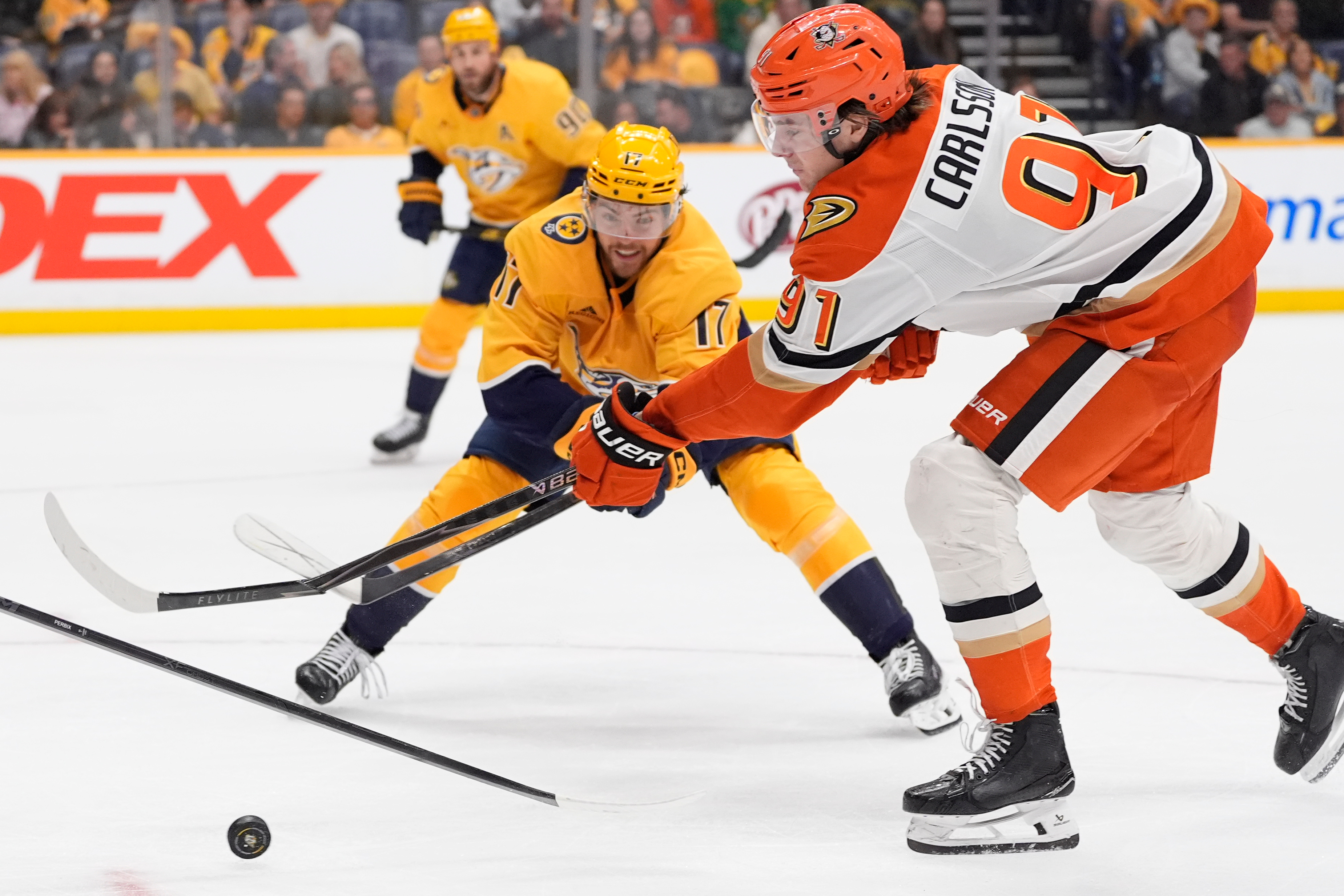 Ducks center Leo Carlsson (91) breaks his sticks he shoots...