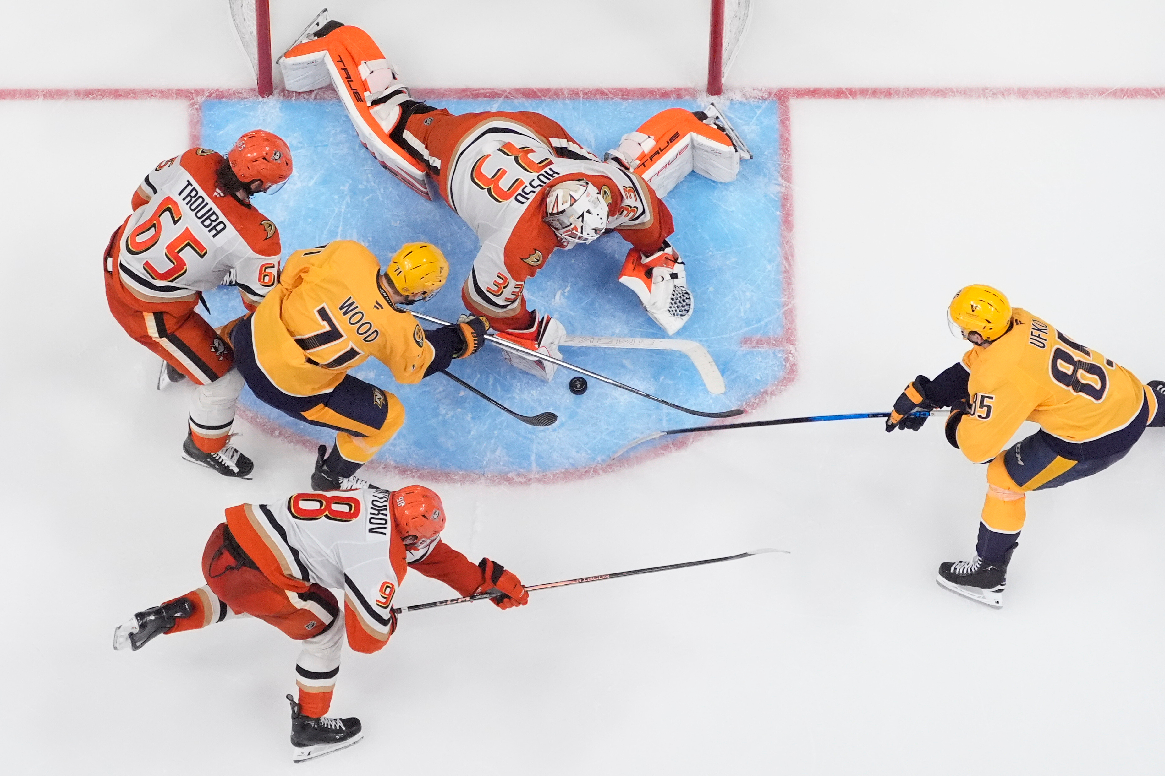 Ducks goaltender Ville Husso (33) blocks a shot on boal...