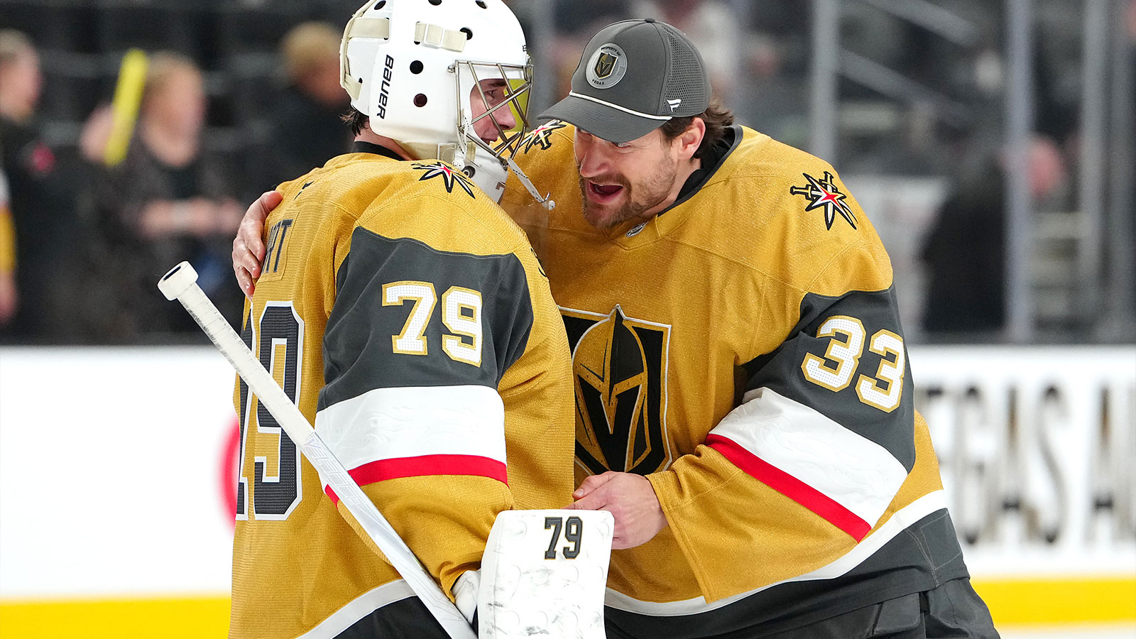 Vegas Golden Knights goaltender Carter Hart (79) is congratulated by goaltender Adin Hill (33) after the Golden Knights defeated the Calgary Flames 6-3 at T-Mobile Arena.