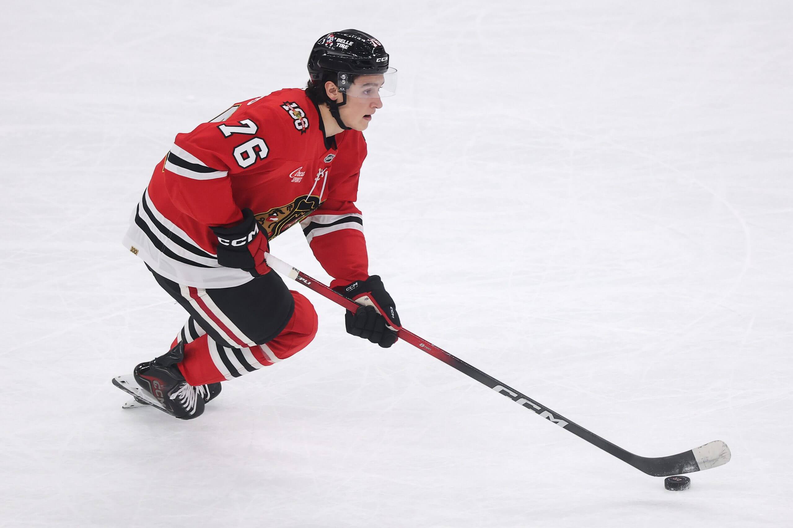 Nick Lardis skates with the puck during a Blackhawks game.