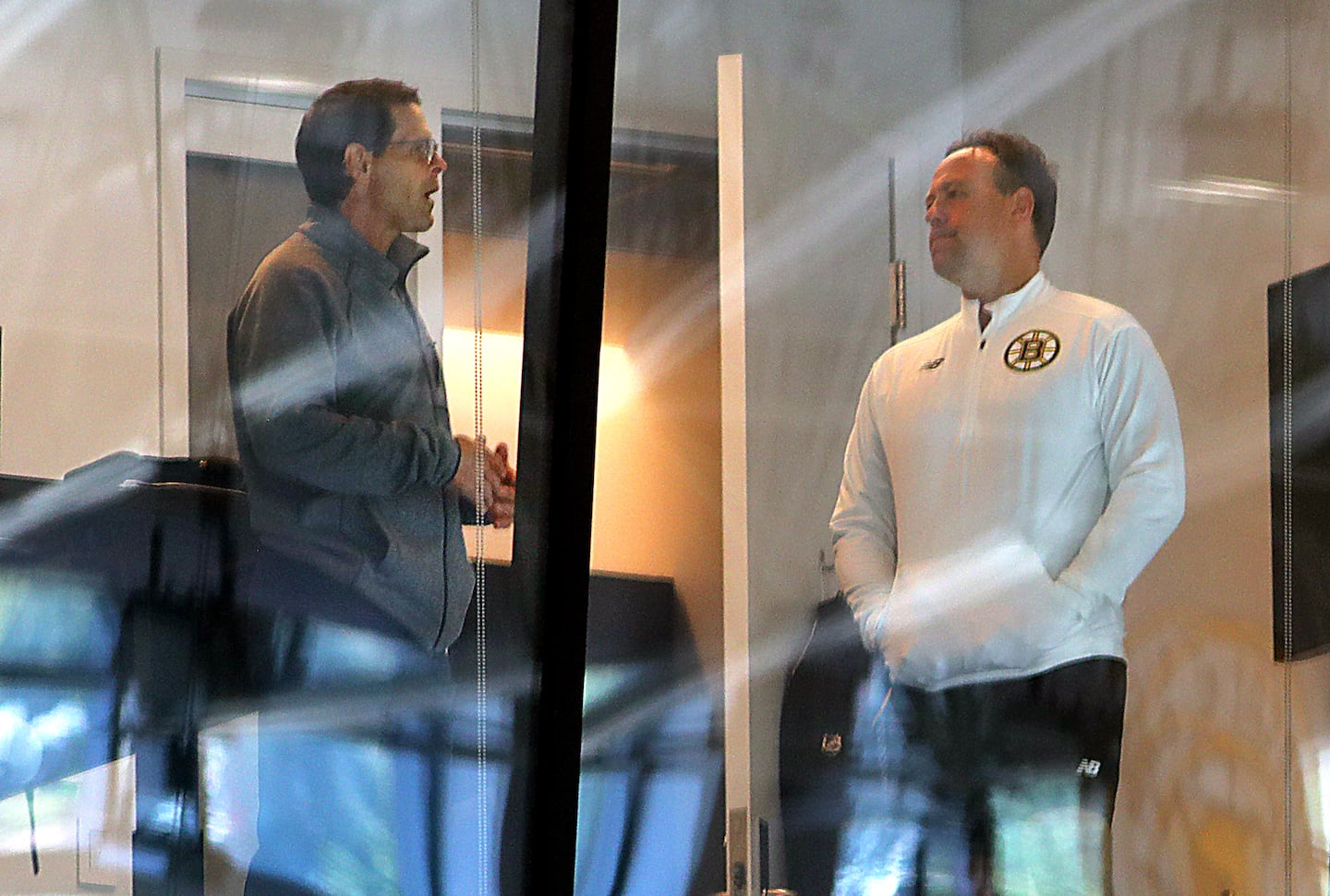 Marco Sturm (right) has delivered for Don Sweeney in his first chance at an NHL head coaching job.