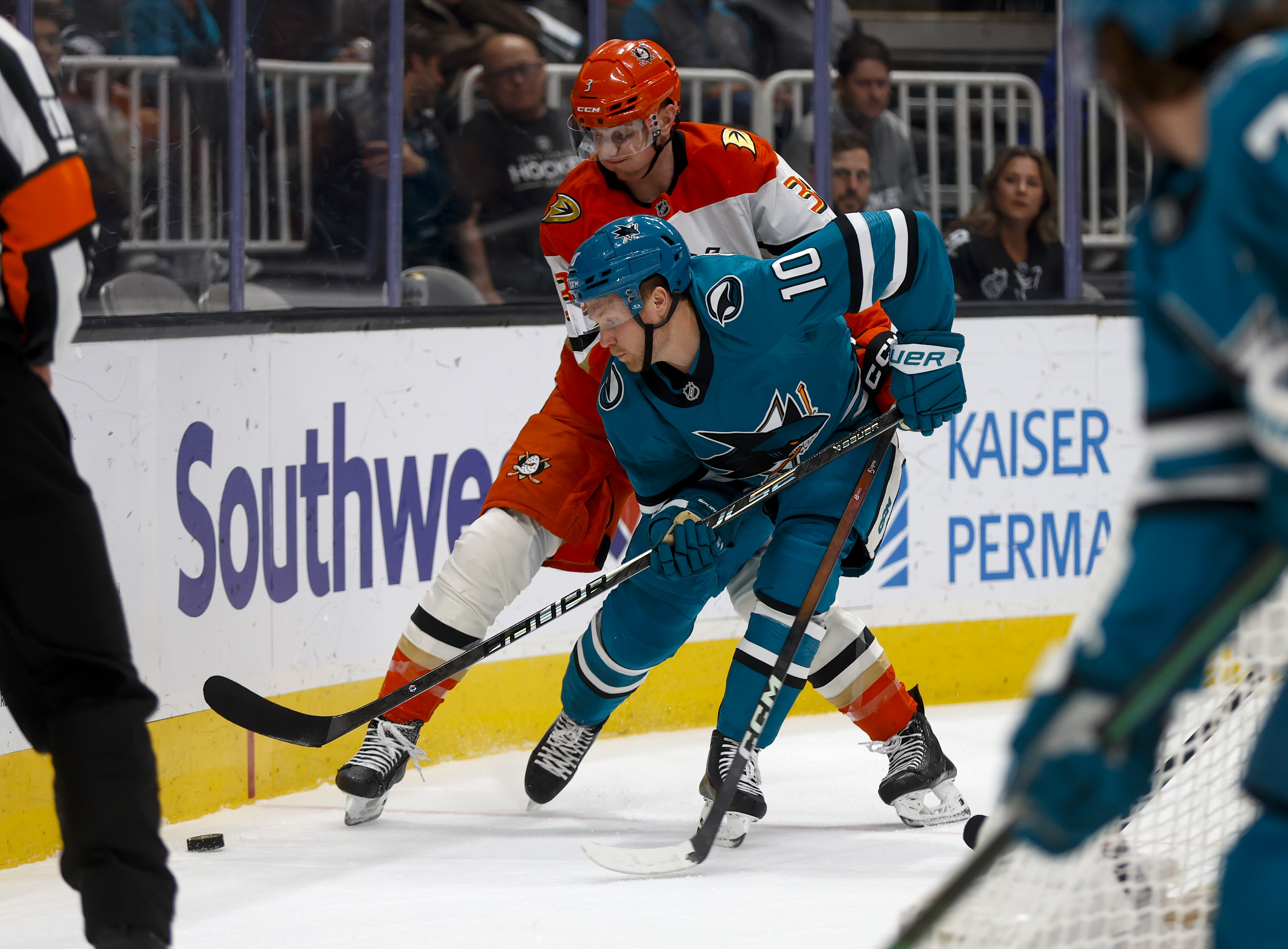 San Jose Sharks' Ty Dellandrea (10) fights for the puck...