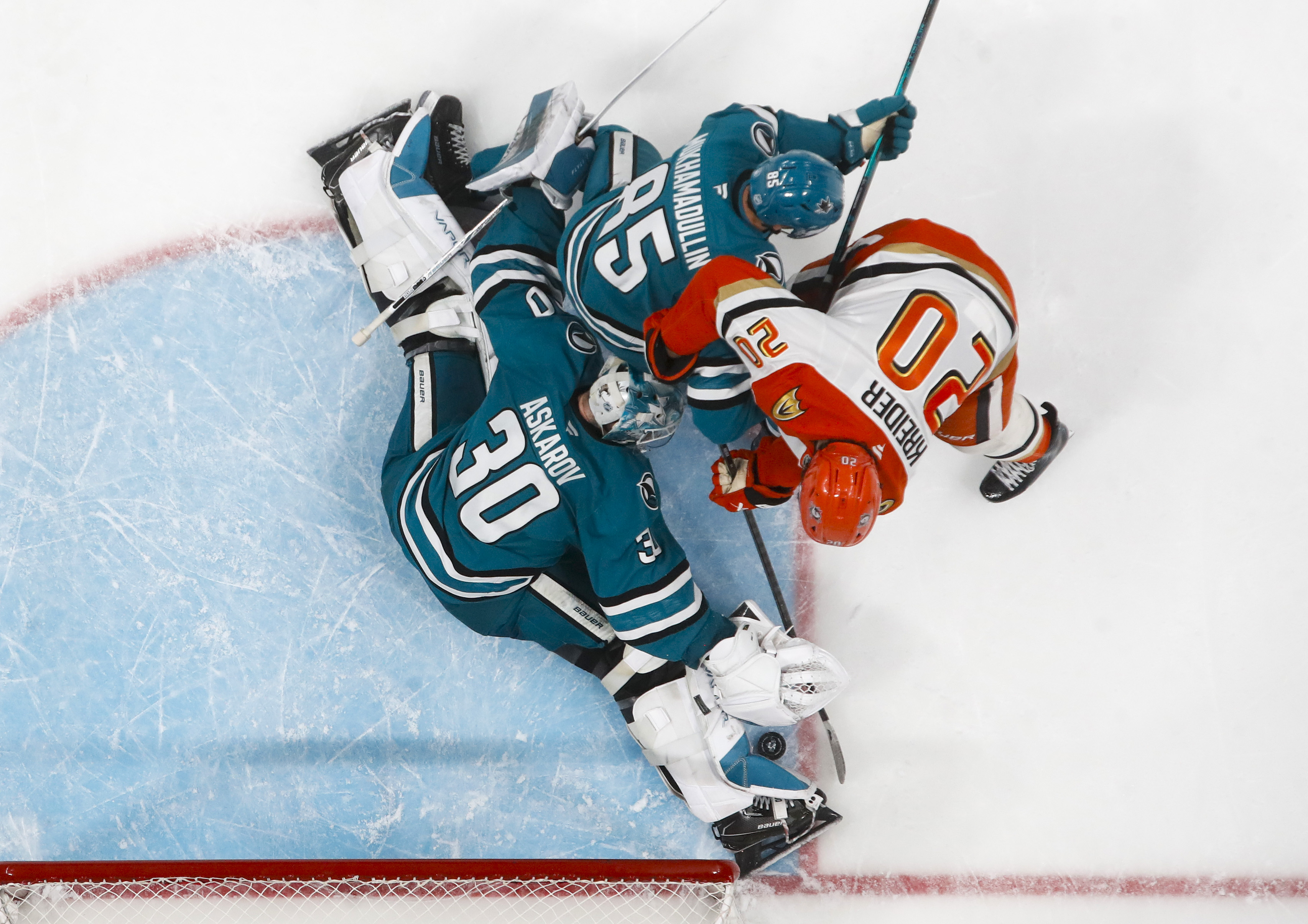 San Jose Sharks goaltender Yaroslav Askarov (30) blocks a shot...