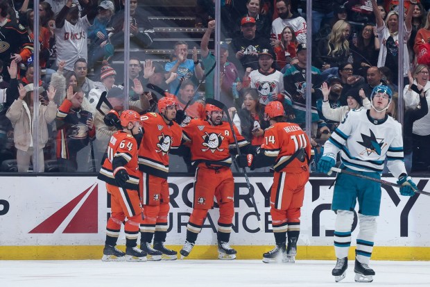 Anaheim Ducks left wing Alex Killorn, third from left, celebrates with, from left to right, center Mikael Granlund, defenseman Tyson Hinds, and defenseman Drew Helleson after scoring during the second period of an NHL hockey game against the San Jose Sharks, Thursday, April 9, 2026, in Anaheim, Calif. (AP Photo/Ryan Sun)