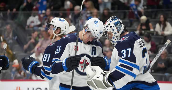 Winnipeg Jets blow two-goal lead before downing Blackhawks 4-3 in OT - Winnipeg