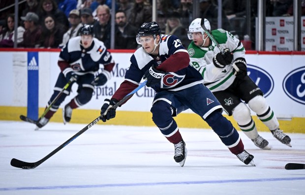 Avalanche forward Nathan MacKinnon skates ahead of the Stars' Craig Smith on Feb. 27, 2024, in Denver. (AAron Ontiveroz/Denver Post)
