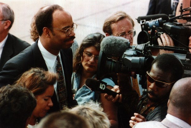 U.S. Rep. Mel Reynolds and his wife, Marisol, bottom left, arrive for a hearing on July 25, 1997. (José Moré/Chicago Tribune)