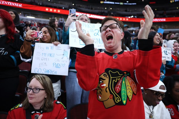 Chicago Blackhawks fan Pete Danakis cheers as the team takes the ice for warmups for a game against the San Jose Sharks at the United Center in Chicago on April 15, 2026. (Chris Sweda/Chicago Tribune)