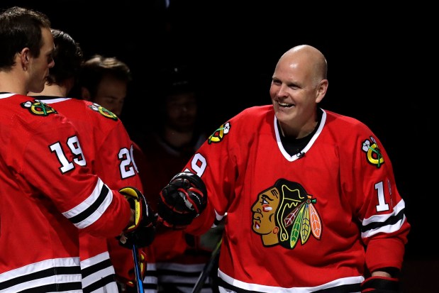 Troy Murray, right, greets Blackhawks center Jonathan Toews before a game against the Senators on Feb. 21, 2018, at the United Center. (Nam Y. Huh/AP file)