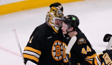 Boston Bruins goaltender Jeremy Swayman (1) is congratulated by center James Hagens (44) after a win against the New Jersey Devils following a hockey game, Tuesday, April 14, 2026, in Boston. (AP Photo/Charles Krupa)