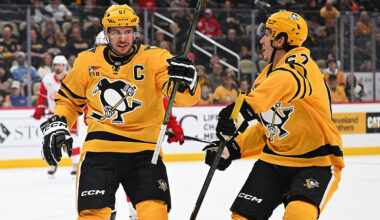 PITTSBURGH, PENNSYLVANIA - JANUARY 1: Sidney Crosby #87 of the Pittsburgh Penguins celebrates with Rickard Rakell #67 after scoring his second goal in the first period against the Detroit Red Wings at PPG PAINTS Arena on January 1, 2026 in Pittsburgh, Pennsylvania. (Photo by Justin Berl/Getty Images)