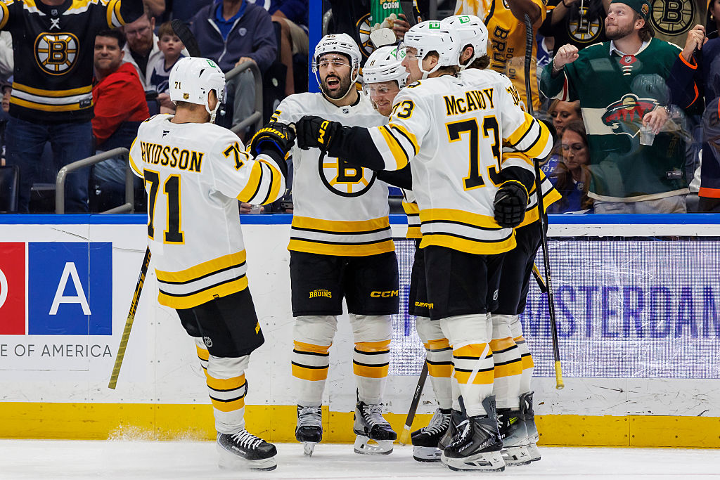 TAMPA, FL - APRIL 4: Casey Mittelstadt #11 of the Boston Bruins celebrates a goal with teammates Viktor Arvidsson #71, Jonathan Aspirot #45, and Charlie McAvoy #73 against the Tampa Bay Lightning at Benchmark International Arena on April 4, 2026 in Tampa, Florida. (Photo by Mark LoMoglio/NHLI via Getty Images)