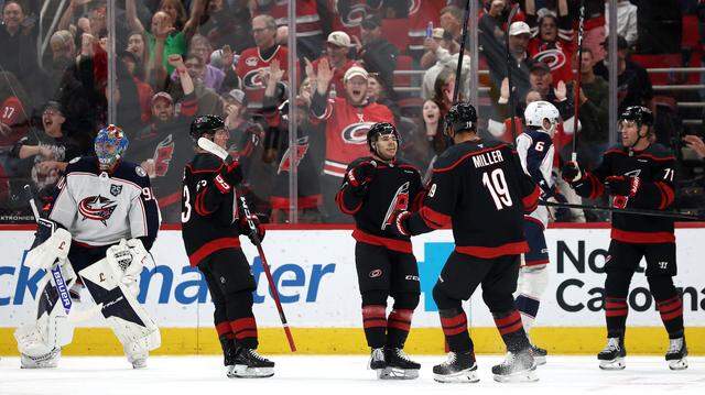 The Carolina Hurricanes celebrate a goal scored by Logan Stankoven (22) during the first period against the Columbus Blue Jackets at Lenovo Center on April 2, 2026 in Raleigh, North Carolina.