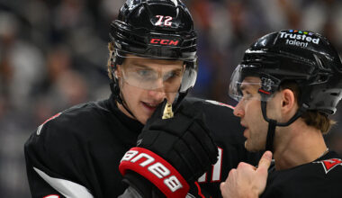 BUFFALO, NEW YORK - APRIL 6: Josh Norris #9 talks with Tage Thompson #72 of the Buffalo Sabres before a faceoff during an NHL game against the Tampa Bay Lightning at KeyBank Center on April 6, 2026 in Buffalo, New York. (Photo by Joe Hrycych/Getty Images)