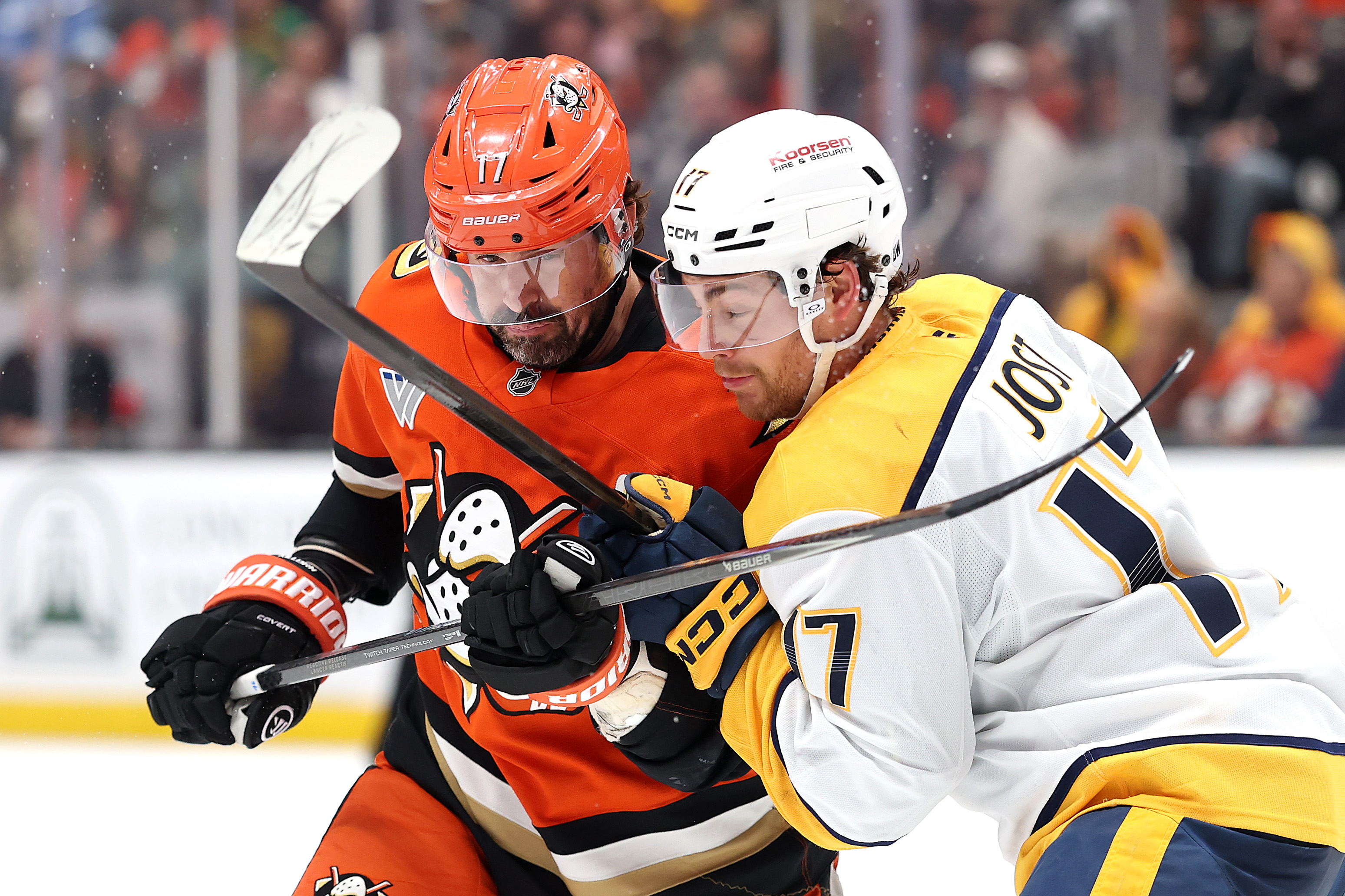 The Ducks’ Alex Killorn, left, collides with the Nashville Predators’...