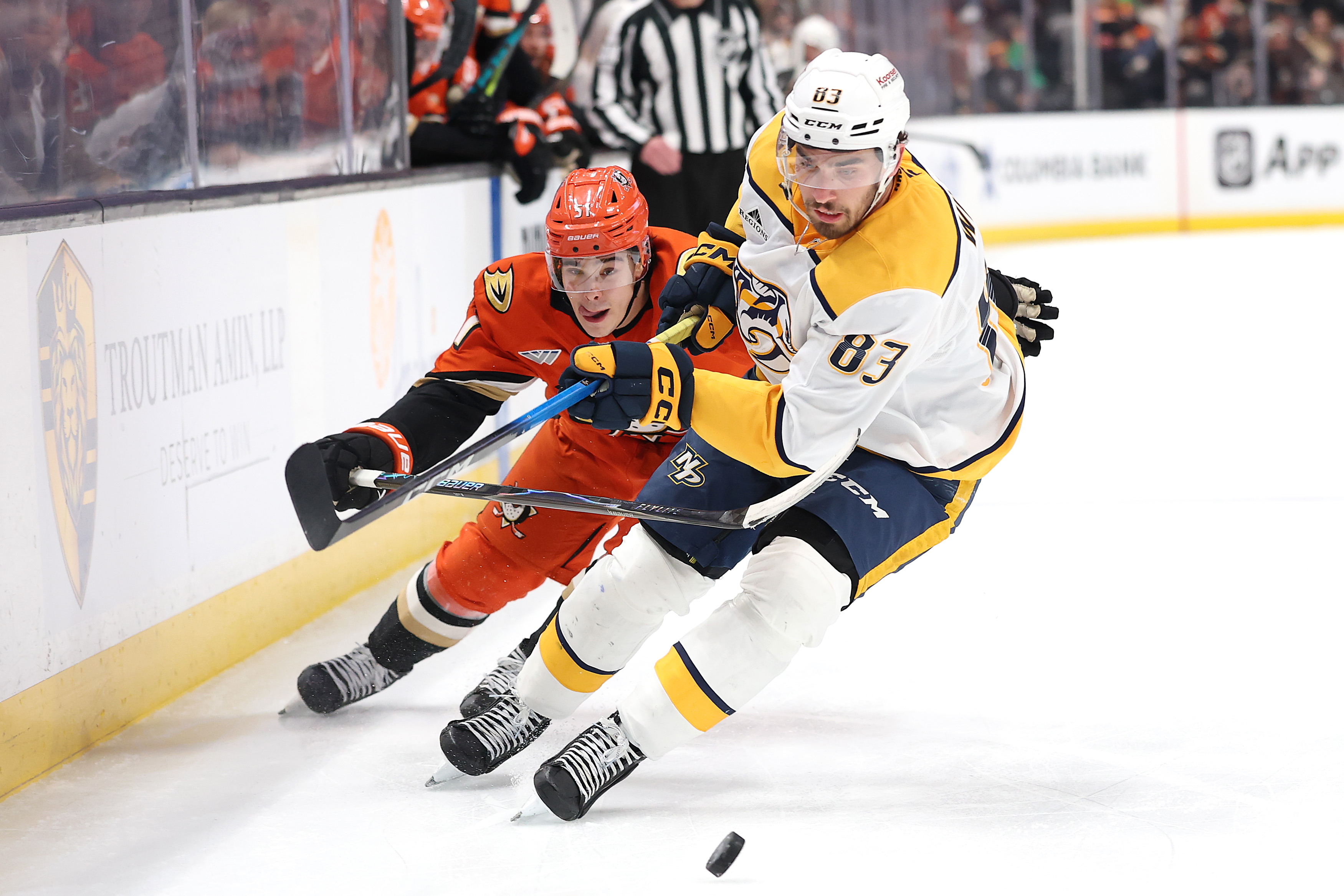 The Ducks’ Olen Zellweger, left, battles the Nashville Predators’ Adam...