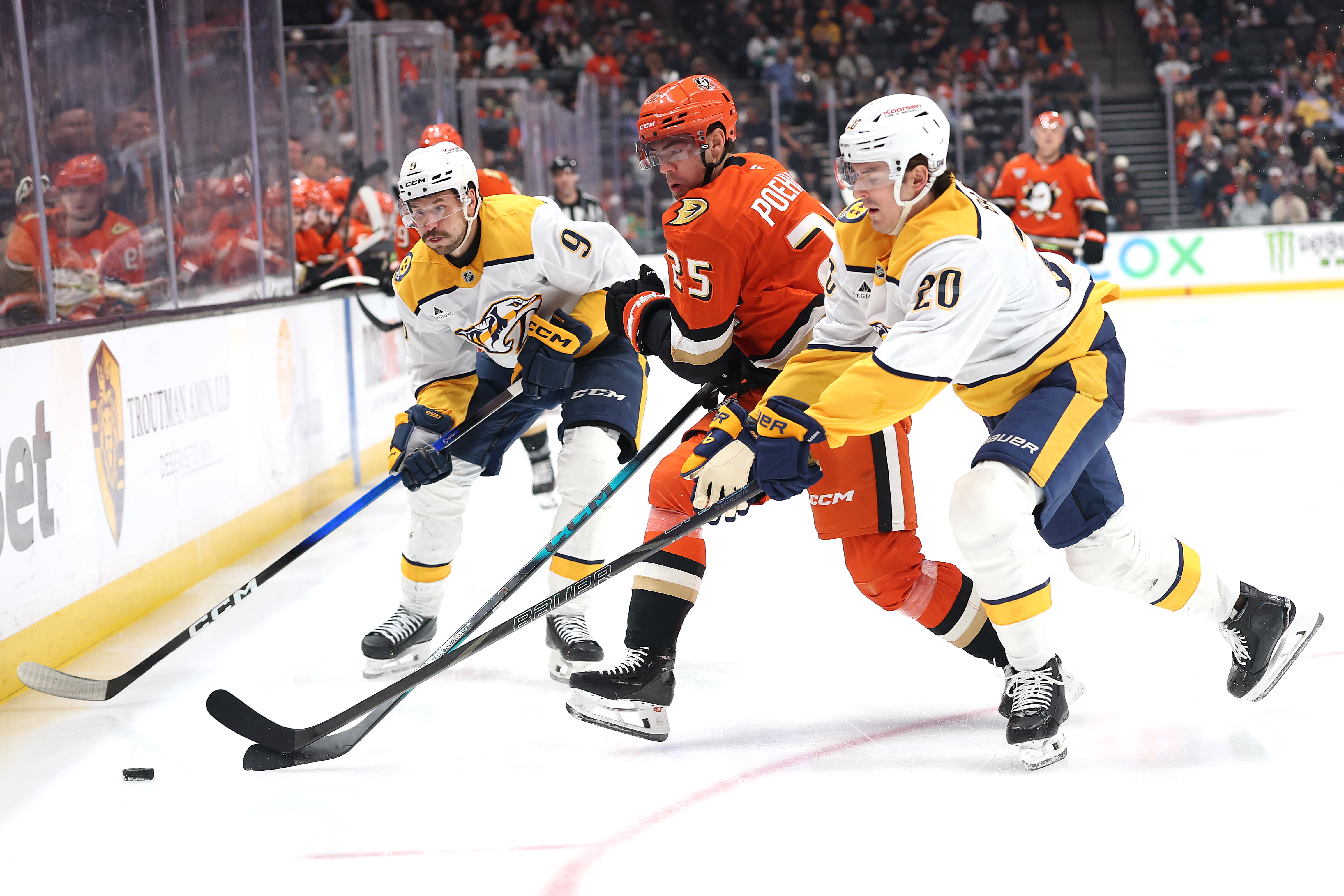 The Nashville Predators’ Justin Barron, right, and Filip Forsberg (9)...