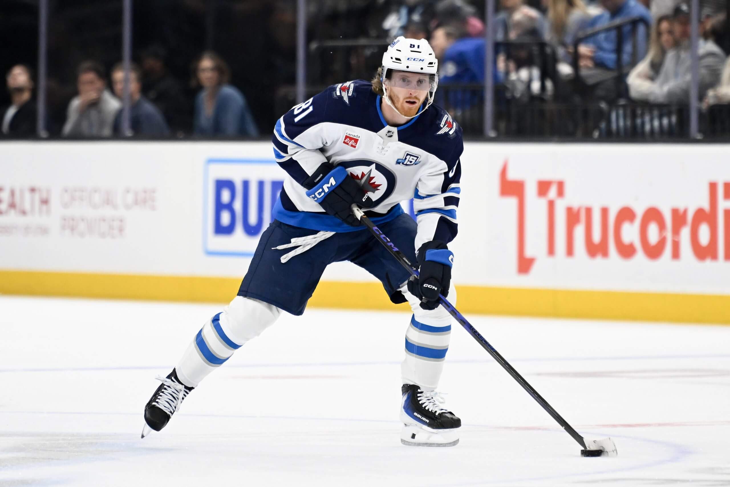 Kyle Connor skates with the puck.